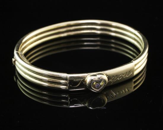 An 18ct gold Chopard I Love You hinged bangle, gross weight 31 grams.